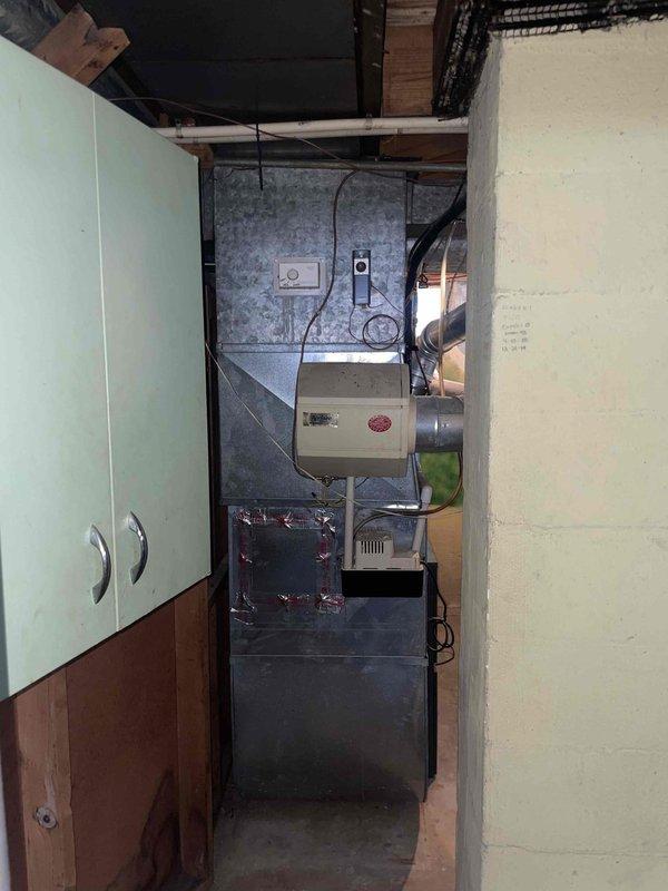 Provided comprehensive estimate for replacement of 30-year-old air conditioning system with existing equipment located in basement alongside natural gas furnace. Current AC unit is operational but has reached end of expected service life. Assessed existing installation configuration, electrical service capacity at meter location, and basement mechanical room layout to determine appropriate replacement equipment specifications and installation requirements.