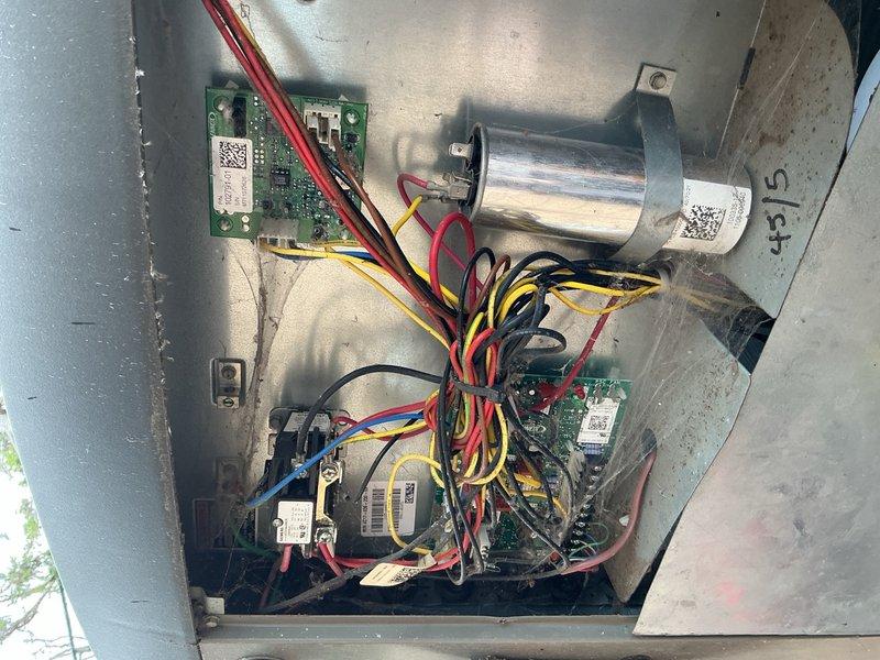 Completed comprehensive Gold AC inspection on a 10+ year old single-unit residential air conditioning system with air handler located in basement. Performed thorough visual and operational assessment of outdoor condenser unit, confirming proper fan operation and adequate airflow through louvered panels. Inspected electrical control panel and internal components including circuit boards, capacitor (45/5 MFD), transformers, relay boards, and control modules. Verified all electrical connections, wiring integrity, and proper component function. System operational and performing within normal parameters at time of inspection.