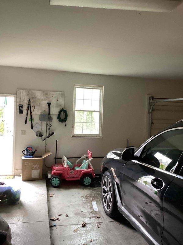 Conducted site evaluation for new mini split installation in sunroom area. Assessed interior space with beadboard paneling, identified electrical outlet locations, and evaluated garage area for potential equipment placement and line routing. Documented existing conditions and structural considerations to develop installation plan for ductless heating and cooling system.