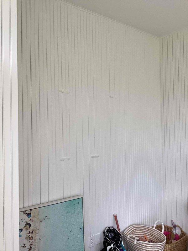 Conducted site evaluation for new mini split installation in sunroom area. Assessed interior space with beadboard paneling, identified electrical outlet locations, and evaluated garage area for potential equipment placement and line routing. Documented existing conditions and structural considerations to develop installation plan for ductless heating and cooling system.