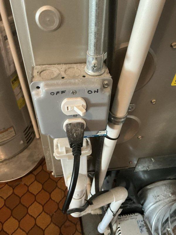 Completed comprehensive Gold AC inspection on 6-year-old residential air conditioning system with air handler located in utility/back of house area. Performed full system evaluation including electrical component inspection, verified capacitor connections and contactor operation, checked all wiring terminations for proper connections and secure mounting. Inspected disconnect switch operation, confirmed proper electrical supply to unit, and examined blower motor assembly. Verified condensate drain line routing and functionality. All electrical components including capacitor, contactor, and control wiring found in good operational condition with proper connections. System operating as designed with no deficiencies noted during inspection.