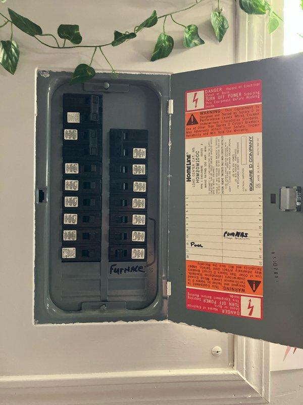 Completed comprehensive furnace inspection and replacement estimate for basement-installed heating system of unknown age. Documented existing electrical panel configuration showing dedicated furnace circuit breaker, photographed current system specifications, and provided detailed replacement options for residential forced-air heating equipment.