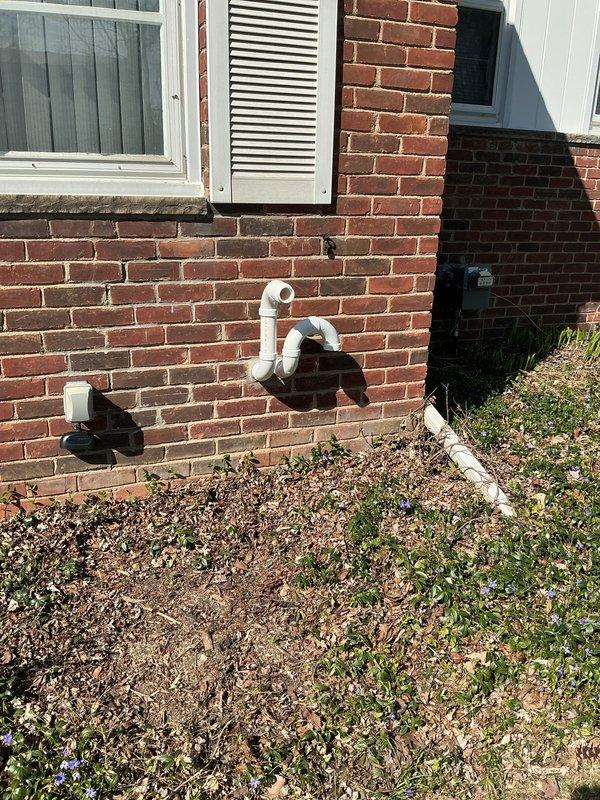 Completed full HVAC system installation including 70,000 BTU furnace, 3-ton rear-discharge air conditioning unit with AHRI certification #215664802, humidifier, and liner. Installed 40-gallon hot water heater with pump and reconnected all necessary utilities. Performed pressure switch testing using diagnostic equipment, confirming proper system operation with readings of 6.76 and 6.86 inWC. Installed exterior PVC condensate drainage lines through brick exterior wall with proper termination and grading. Obtained mechanical and electrical permits for all installed equipment, and system qualifies for applicable utility rebates.