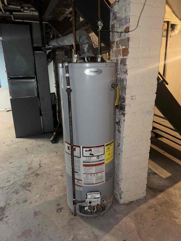 Responded to service call for furnace diagnostic and water heater inspection. Upon arrival, accessed basement mechanical room and performed comprehensive visual inspection of both units. Examined furnace cabinet, verified proper clearances, and inspected visible components including blower assembly, control board access, and gas connections. Assessed overall condition of heating system and documented equipment age and operational status. Conducted thorough inspection of Whirlpool water heater, examining temperature and pressure relief valve, gas control valve, pilot assembly, and all visible piping connections including copper supply lines and venting system. Verified proper installation of safety components and checked for signs of corrosion, leaks, or deterioration. Photographed both units and mechanical room configuration for documentation purposes. Provided assessment findings and recommendations to customer regarding repair versus replacement options for furnace system based on eq