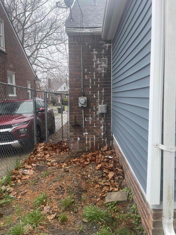 Conducted on-site evaluation for complete air conditioning system replacement at residential property with natural gas furnace located in basement. Assessed existing ductwork configuration including galvanized metal plenum with trapezoidal junction box and cylindrical supply ducts, noting standard operational wear and dust accumulation but no structural deficiencies requiring immediate remediation. Evaluated exterior installation location along side yard utility area adjacent to electrical meter and prepared comprehensive replacement estimate for new AC system compatible with existing natural gas heating infrastructure.