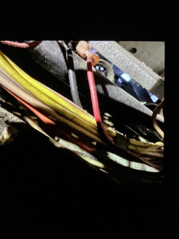 Performed furnace inspection and documented existing equipment condition. Observed significant corrosion on gas supply piping and general wear on internal components including gas valve assembly, electrical connections, and wiring harnesses. Photographed corroded horizontal gas line, control wiring, and mechanical components showing age-related deterioration for customer records and future service reference.