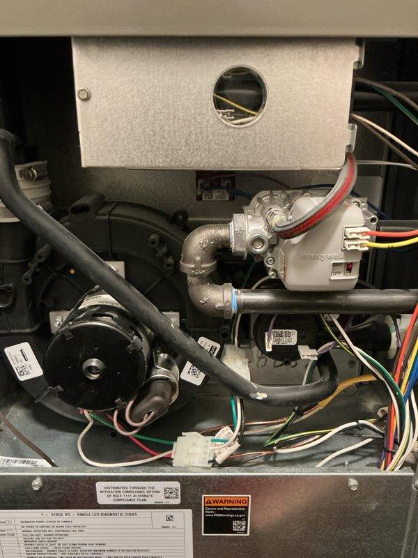 # HVAC Maintenance - Gold Furnace Inspection

Performed comprehensive Gold-level furnace inspection on residential forced-air heating system located in basement. Conducted thorough visual examination of all internal components including blower motor assembly, gas valve, heat exchanger, electrical connections, and control systems. Inspected wiring harnesses for proper routing and secure connections, verified all wire terminals and color-coded conductors were intact. Examined gas valve operation and piping connections for proper installation and safety compliance.

Assessed blower motor assembly and housing for operational integrity. Verified all manufacturer labels, specification plates, and warning decals were legible and properly affixed to equipment. Inspected combustion air openings and ventilation pathways. Checked electrical control board, safety switches, and limit controls for proper function. Examined condensate drainage system and tubing for clamps and secure mounting.

Evalua