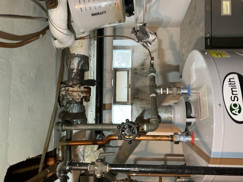 Completed comprehensive tune-up on 10-year-old air conditioning system in basement location. Performed standard maintenance procedures including inspection of condensing unit, evaporator coil, refrigerant levels, electrical connections, and ductwork connections. Verified Aprilaire humidifier integration with HVAC system and confirmed proper operation of all components; system operating within normal parameters with no deficiencies noted at time of service.