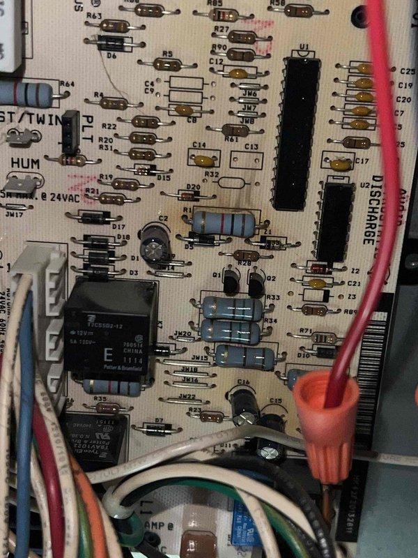 Responded to no heat call on 20+ year old furnace in utility room with symptom of unit turning on then shutting off after approximately one minute of operation. Performed diagnostic evaluation and inspected control board circuitry, identifying failed relay component on main circuit board causing premature safety shutdown. Inspected furnace cabinet access latch and overall unit condition during troubleshooting process. Recommended control board replacement due to age of equipment and component failure to restore reliable heating operation.