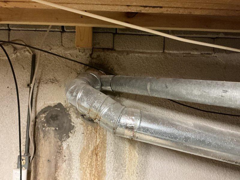 Responded to gas water heater leak in basement utility area. Upon inspection, confirmed A.O. Smith ProLine tanked water heater exhibited active leak at base of tank with rust-colored water pooling on concrete floor. Leak originated from tank itself rather than supply lines or connections, indicating internal tank corrosion and failure. Extensive rust staining on floor and adjacent wall confirmed leak had been occurring for approximately three weeks. Diagnosed tank as beyond repair due to compromised internal integrity. Recommended and coordinated full water heater replacement as tank leaks cannot be effectively repaired. Documented existing conditions including water damage to surrounding area and deteriorated tank condition for replacement planning.