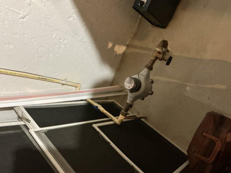 Responded to service call for leaking bathtub faucet. Upon arrival, conducted diagnostic inspection of bathroom plumbing system. Accessed under-sink plumbing through vanity cabinet to assess water supply lines and shut-off valves. Inspected visible PVC drain assembly, chrome P-trap, and braided metal flex supply lines for signs of moisture or deterioration. Examined main water supply valve assembly in mechanical room, including brass valve components, pressure relief valve, and associated copper and PEX piping connections. Documented existing plumbing configuration with photographs for service records. Identified source of leak and completed necessary repairs to restore proper function and eliminate water loss.