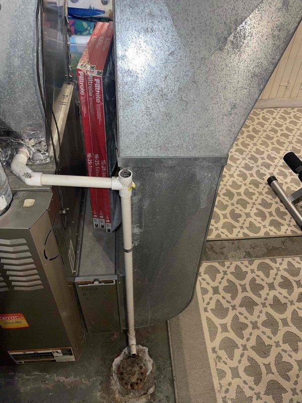 Provided comprehensive estimate for complete HVAC system replacement including air conditioning unit and natural gas furnace located in basement. Current 13-year-old system is non-operational and requires full replacement. Assessed existing installation with reflective insulation, PVC condensate drainage, and ventilation components to determine proper equipment sizing and configuration for new system installation.