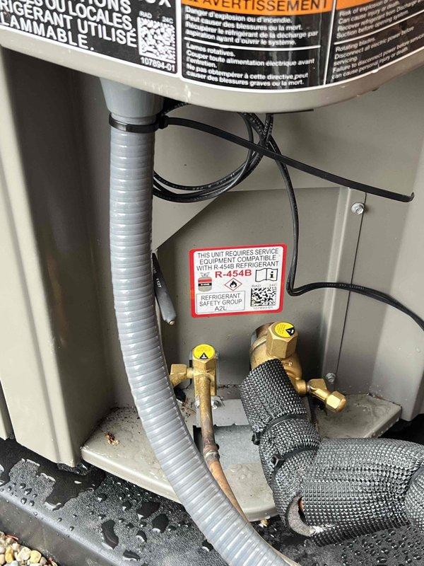 Completed air conditioning system start-up and inspection on residential split system with Lennox outdoor condensing unit and basement evaporator coil. Verified proper system operation, checked electrical connections, inspected refrigerant lines and drainage, and documented equipment condition with photographs for service records.