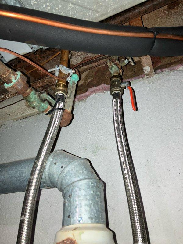 Conducted site assessment for replacement of 33-year-old Carrier WeatherMaker 8000 furnace located in basement. Documented existing system configuration including horizontal vent connections, flexible ductwork routing to ceiling plenum, and adjacent Honeywell air filtration unit. Evaluated current mechanical room layout, copper piping infrastructure, electrical connections, and existing supply line conditions with brass fittings showing age-related corrosion. Provided comprehensive replacement estimate addressing complete furnace system upgrade requirements.