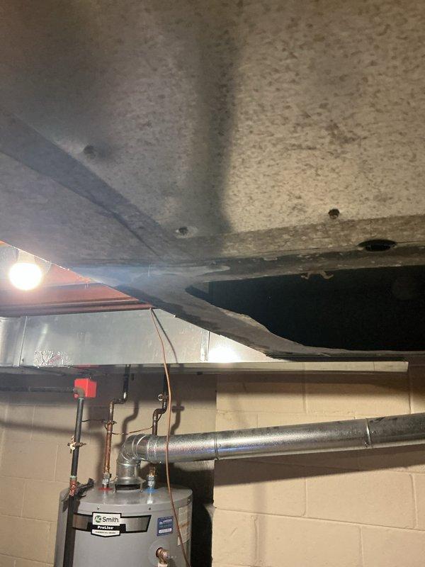 Completed full HVAC system installation including a 135,000 BTU furnace and 4-ton air conditioning unit with rear discharge configuration in basement utility area. Obtained mechanical permits prior to installation as required. Installed new humidifier system integrated with furnace for whole-home humidity control. Reconnected all existing ductwork to new equipment, ensuring proper airflow distribution throughout the residence. Verified all electrical connections, gas line connections, and condensate drainage systems operating correctly. System tested and confirmed operational with proper temperature differential and airflow measurements meeting manufacturer specifications.