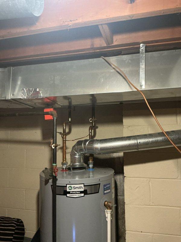 Completed full HVAC system installation including a 135,000 BTU furnace and 4-ton air conditioning unit with rear discharge configuration in basement utility area. Obtained mechanical permits prior to installation as required. Installed new humidifier system integrated with furnace for whole-home humidity control. Reconnected all existing ductwork to new equipment, ensuring proper airflow distribution throughout the residence. Verified all electrical connections, gas line connections, and condensate drainage systems operating correctly. System tested and confirmed operational with proper temperature differential and airflow measurements meeting manufacturer specifications.