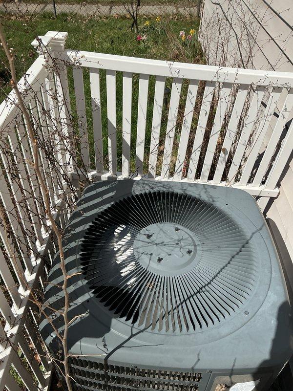 Completed comprehensive Gold AC Inspection and tune-up on residential air conditioning system under plan membership. Performed full system evaluation including condenser unit inspection, verified operational status of all components, and documented unit condition with photos. Noted vegetation overgrowth around outdoor condenser unit requiring future clearance to maintain optimal airflow and system efficiency.