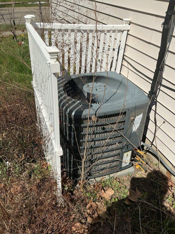 Completed comprehensive Gold AC Inspection and tune-up on residential air conditioning system under plan membership. Performed full system evaluation including condenser unit inspection, verified operational status of all components, and documented unit condition with photos. Noted vegetation overgrowth around outdoor condenser unit requiring future clearance to maintain optimal airflow and system efficiency.