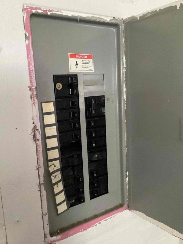 Conducted on-site assessment for furnace replacement estimate in utility room. Current natural gas furnace is non-operational with unknown age and requires full replacement. Evaluated existing installation location, electrical service panel with adequate circuit capacity, and surrounding infrastructure including water heater and HVAC equipment to determine proper sizing and installation requirements for new gas furnace system.