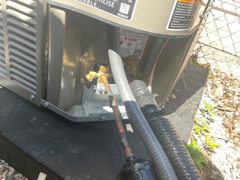 Completed AC system startup and inspection for basement coil installation. Verified outdoor condenser unit operation, checked refrigerant line connections and fittings for proper seal, and confirmed all electrical connections secure. Unit tested and running within normal operating parameters.