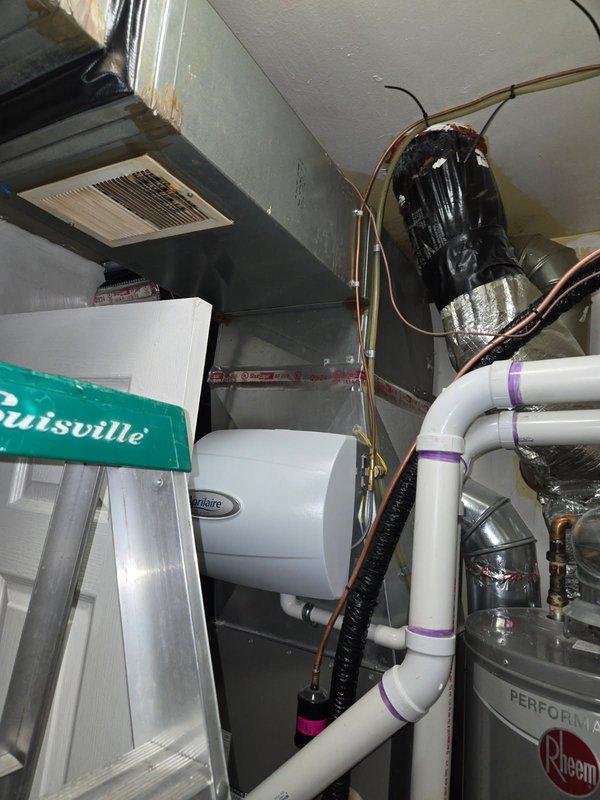 Responded to service call for inadequate heating on 1-year-old furnace system located in basement. Upon inspection, discovered multiple unsealed penetrations and gaps in ceiling where HVAC components pass through, resulting from improper installation completion. Identified exposed ductwork connections, unsealed motor penetration with visible staining around opening, and inadequate sealing of refrigerant line and condensate drain penetrations. Documented deficiencies including missing fire-stopping material, air leakage points, and compromised building envelope where mechanical components enter living space. These installation deficiencies were causing significant heat loss and reduced system efficiency, directly impacting comfort levels in conditioned space.