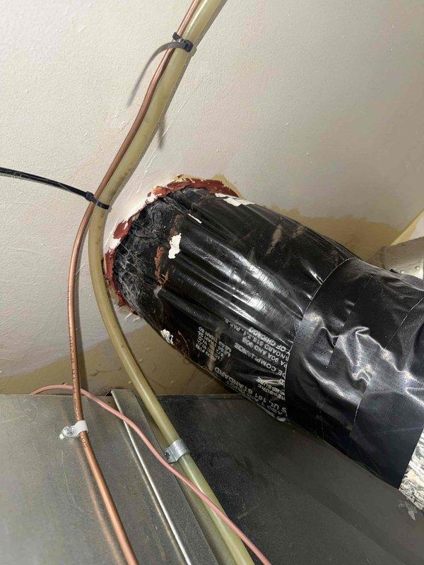 Responded to service call for inadequate heating on 1-year-old furnace system located in basement. Upon inspection, discovered multiple unsealed penetrations and gaps in ceiling where HVAC components pass through, resulting from improper installation completion. Identified exposed ductwork connections, unsealed motor penetration with visible staining around opening, and inadequate sealing of refrigerant line and condensate drain penetrations. Documented deficiencies including missing fire-stopping material, air leakage points, and compromised building envelope where mechanical components enter living space. These installation deficiencies were causing significant heat loss and reduced system efficiency, directly impacting comfort levels in conditioned space.