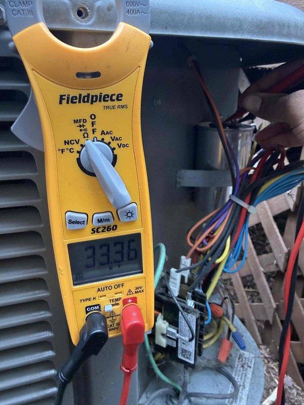 Completed Gold AC inspection on non-operational residential air conditioning system over 10 years old with air handler located in basement. Performed comprehensive diagnostic testing using digital multimeter, measuring electrical parameters at condensing unit including voltage readings of 333.0V, and inspected all wiring connections and control circuits. Evaluated outdoor condensing unit condition, airflow components, and overall system performance to identify cause of equipment failure.