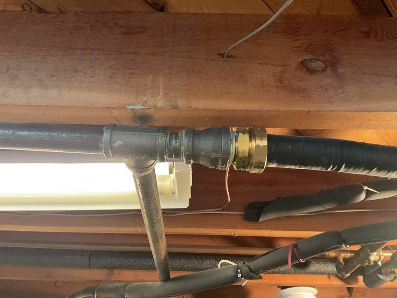 Conducted a no-charge second opinion site visit to reassess and modify original plumbing estimate. Evaluated existing piping configuration in basement area including brass T-junction valve assembly with compression fittings, black flexible tubing connections, and PVC components installed among exposed floor joists. Documented current conditions and reviewed additional copper piping, ductwork, and utility routing in ceiling space to provide revised estimate incorporating requested modifications to original scope of work.