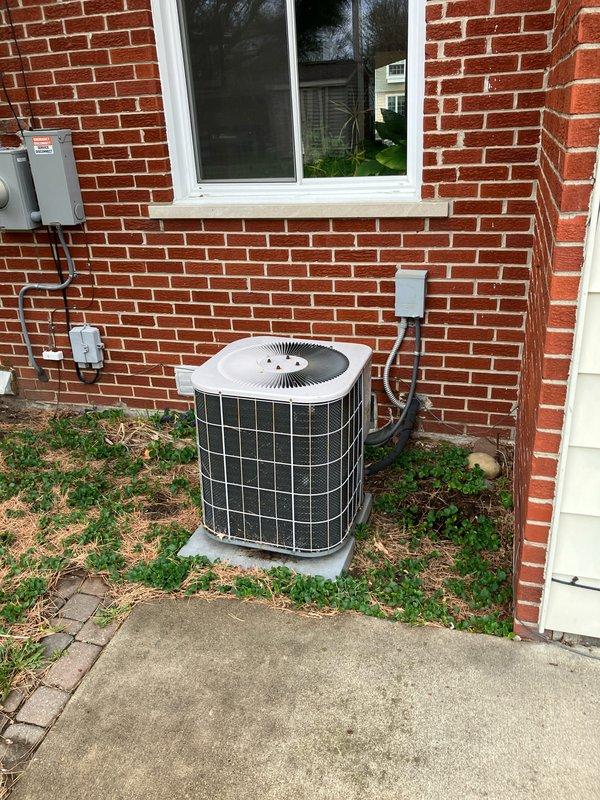 Conducted estimate for air conditioning system replacement at residential property. Existing 30-year-old outdoor condensing unit located on concrete pad in backyard has reached end of serviceable life. Assessed current installation including exterior unit placement, electrical service connections, and existing Emerson thermostat. Documented equipment condition and provided replacement system options for aging AC unit.