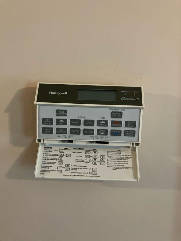 Responded to service call for 30-year-old furnace in basement making loud motor noise that required emergency shutdown. Performed diagnostic evaluation of heating system, assessed equipment condition, and documented existing Honeywell Chronotherm III programmable thermostat and electrical panel configuration. Provided replacement estimate for furnace system due to age and mechanical failure of motor components.