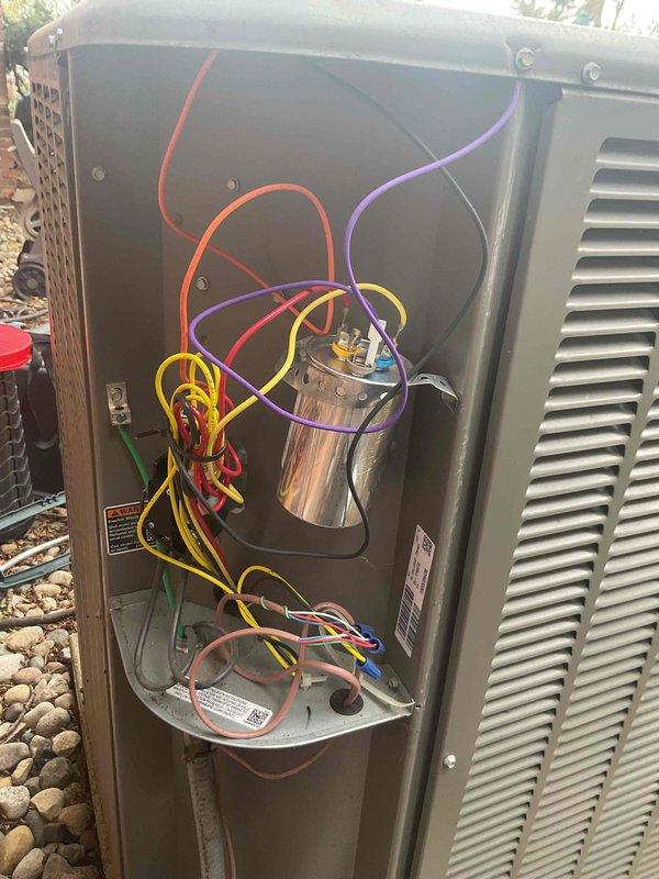 Completed routine AC inspection on 4-year-old residential condensing unit. System operational with all components functioning within normal parameters. Inspected electrical compartment, verified capacitor connections and wiring integrity, and confirmed proper outdoor unit operation.