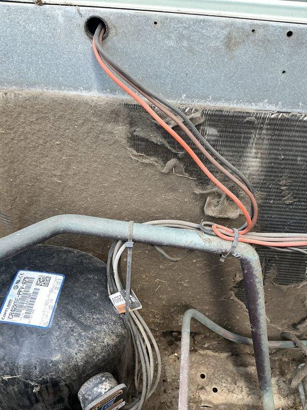 Performed comprehensive tune-up on 6-year-old outdoor air conditioning unit. Inspected and tested contactor, electrical connections, and compressor operation. Cleaned condenser coil of accumulated dust, debris, and lint buildup. Verified refrigerant line connections and insulation integrity. Tested all electrical components including contactor terminals with multiple wire connections. Confirmed proper system operation and airflow. Unit operating within normal parameters following service.