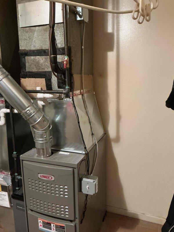 Completed installation of Lennox residential furnace unit with all required electrical connections, venting system, and control components. Installed exhaust vent piping, mounted junction box, configured Testo control module with proper wiring connections including blower motor assembly and capacitors. Permit was requested and all manufacturer specifications were followed for proper system operation.