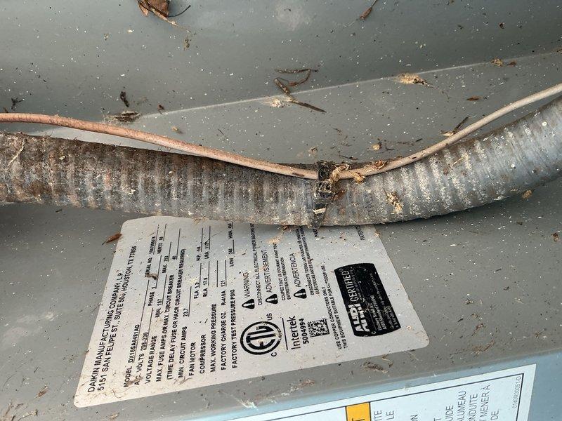 Completed comprehensive Gold AC Inspection on two outdoor air conditioning units. Performed full system evaluation including visual inspection of indoor furnace and air handler components, verified electrical connections and wiring harness integrity, checked blower motor operation, and inspected refrigerant lines and condensate drain system. Documented equipment condition with photographic evidence showing operational HVAC system with accessible internal components and corroded flexible ductwork requiring future attention.