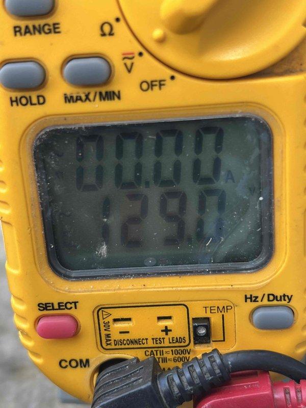 Completed comprehensive annual maintenance on 15-year-old air conditioning unit located outside garage. Performed full system diagnostics using digital multimeter to verify electrical performance, measuring voltage and amperage readings to ensure proper operation of all components. All electrical parameters tested within manufacturer specifications, confirming system functionality and safe operation for continued use.