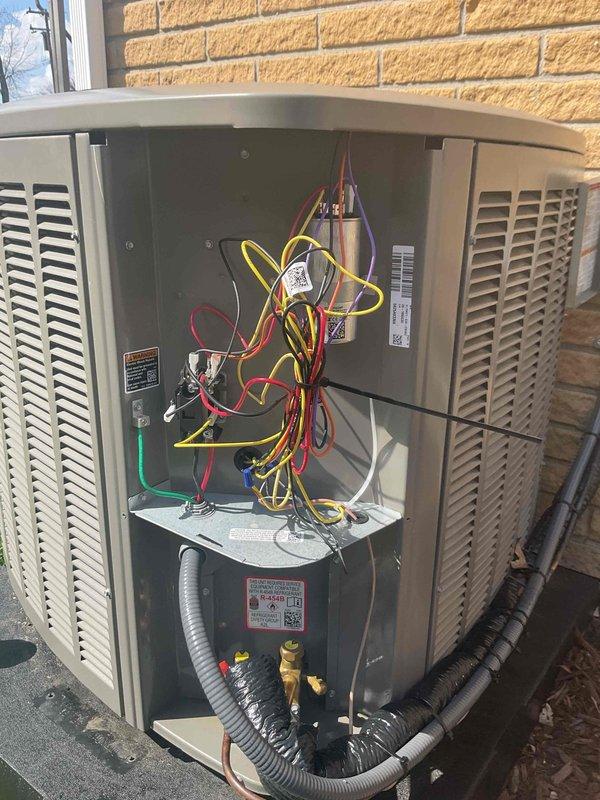 Completed AC system startup for basement evaporator coil installation. Verified proper refrigerant line connections with appropriate insulation materials secured at outdoor condensing unit. Inspected electrical connections, control board wiring, and component operation. System tested and confirmed operational.