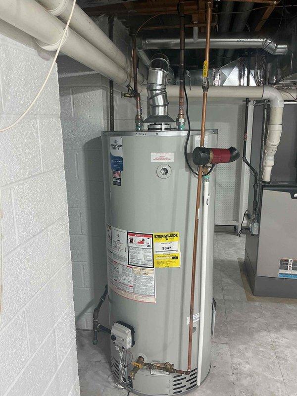 Installed 75-gallon gas-fired tanked water heater in basement mechanical room. Completed all plumbing connections including hot and cold water supply lines using copper piping, connected gas supply line to burner assembly, and installed proper venting through metallic flue pipe. Verified burner ignition and proper flame characteristics, reconnected all utilities, and confirmed unit is operating within manufacturer specifications.