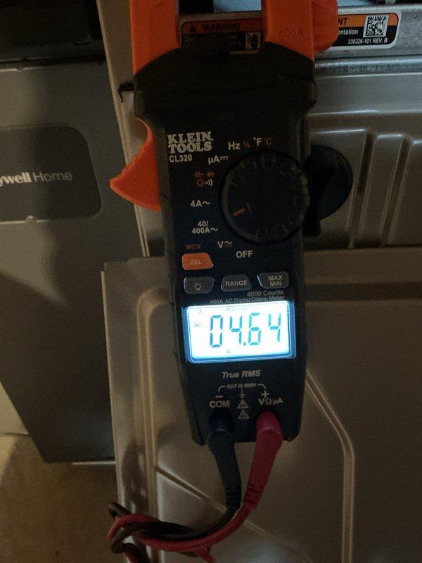 Completed comprehensive tune-up inspection on 4-year-old Bryant air conditioning system with basement coil configuration. Performed full system diagnostics including electrical measurements using clamp meter, verified proper amp draw at 46.4A, and inspected outdoor condensing unit condition. Inspection also included evaluation of humidifier, thermostat operation, and hot water tank as part of complete system assessment, with all components found operating within normal parameters.