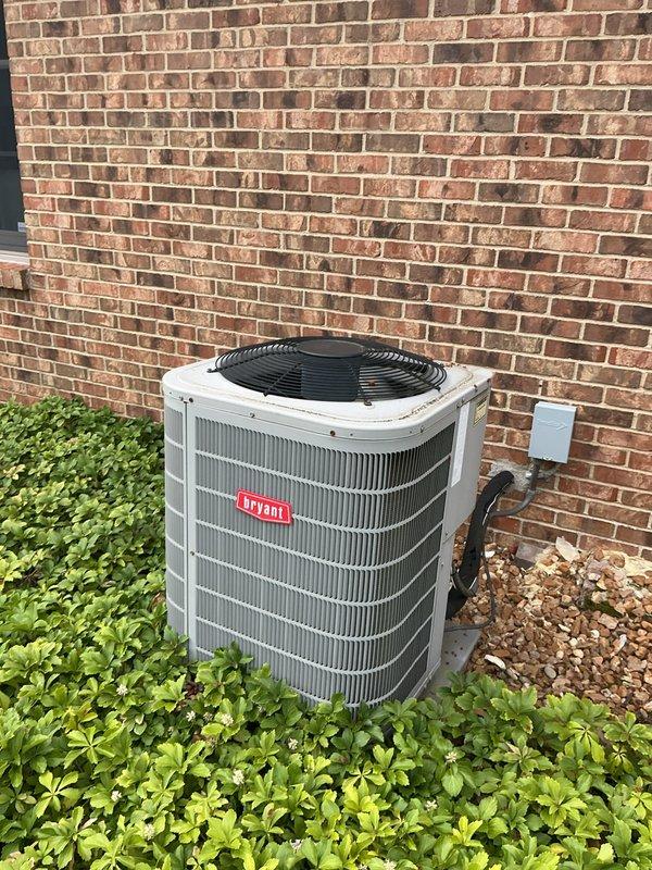 Completed comprehensive tune-up inspection on 4-year-old Bryant air conditioning system with basement coil configuration. Performed full system diagnostics including electrical measurements using clamp meter, verified proper amp draw at 46.4A, and inspected outdoor condensing unit condition. Inspection also included evaluation of humidifier, thermostat operation, and hot water tank as part of complete system assessment, with all components found operating within normal parameters.