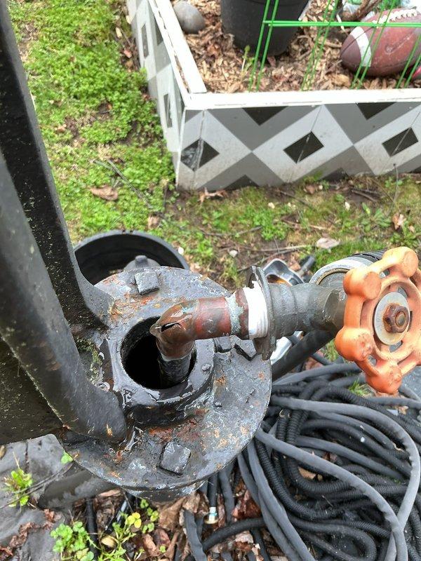 Responded to service call for dripping outdoor spigot in yard. Upon inspection, identified heavily corroded gate valve and pipe assembly with significant rust buildup at connection points. The corrosion was causing seal failure, resulting in continuous dripping from the hose bib. Replaced deteriorated gate valve and corroded pipe fittings with new galvanized components. Secured all connections and tested system under full water pressure to verify leak was eliminated and proper shutoff function was restored.
