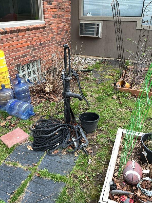 Responded to service call for dripping outdoor spigot in yard. Upon inspection, identified heavily corroded gate valve and pipe assembly with significant rust buildup at connection points. The corrosion was causing seal failure, resulting in continuous dripping from the hose bib. Replaced deteriorated gate valve and corroded pipe fittings with new galvanized components. Secured all connections and tested system under full water pressure to verify leak was eliminated and proper shutoff function was restored.