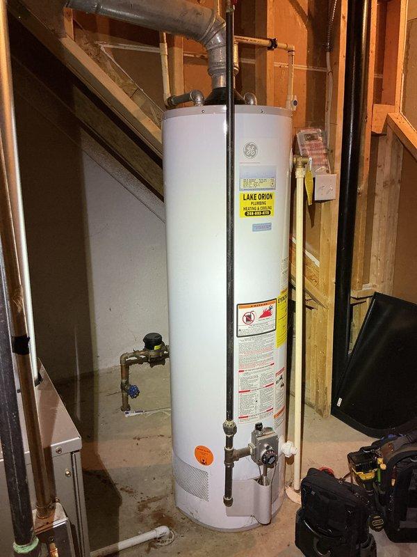 Completed comprehensive Gold AC Inspection on a 2-year-old multi-unit HVAC system with air handler located in basement. Verified Honeywell Home ProSeries thermostat operation and settings, inspected basement-mounted equipment including air handler and associated ductwork connections, and confirmed all system components were functioning properly with no service issues identified at time of inspection.