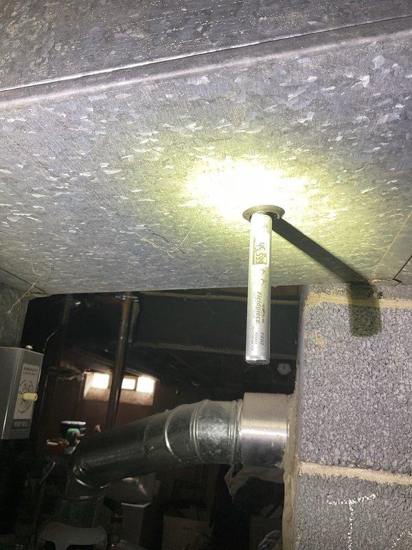 Completed AC system startup on basement evaporator coil installation. Performed electrical diagnostics and measurements using digital multimeter, confirming proper amperage draw of 4.42 amps on blower motor assembly. Verified all copper line connections at coil were secure and properly brazed. System tested and operating within manufacturer specifications.