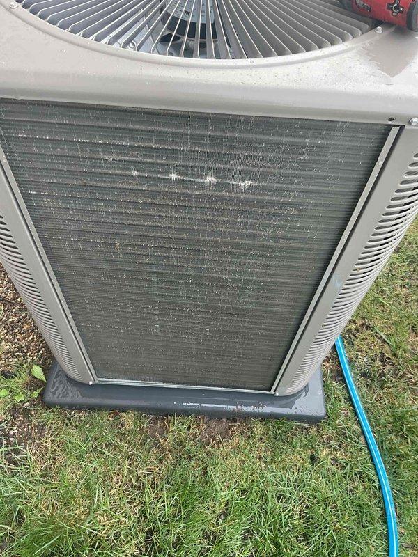 Completed comprehensive spring AC tune-up on 2023 outdoor condensing unit as part of prepaid maintenance plan. Inspected and cleaned heat exchanger coils which showed moderate accumulation of environmental debris and dirt between aluminum fins; performed thorough exterior cabinet cleaning to remove weathering and surface contamination. Verified refrigerant line connections, tested electrical components including fan motor operation, and confirmed system operational readiness for cooling season.