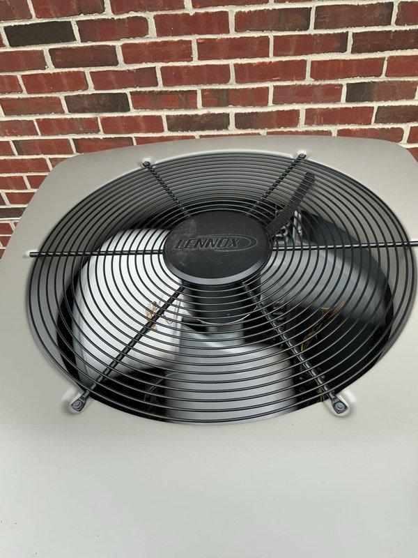Completed comprehensive Gold AC Inspection on dual-unit residential HVAC system consisting of one 1-year-old and one 10-year-old Lennox outdoor condensing units with air handler located in basement. Performed full multi-point inspection including visual examination of both exterior units, verified proper fan operation with protective wire guards intact, checked refrigerant line connections and brass fittings for leaks, inspected electrical conduit and connections, confirmed units mounted securely on concrete pads with adequate clearance from structure, and documented equipment condition through photographic records. Both systems operational at time of inspection with no immediate service concerns identified.