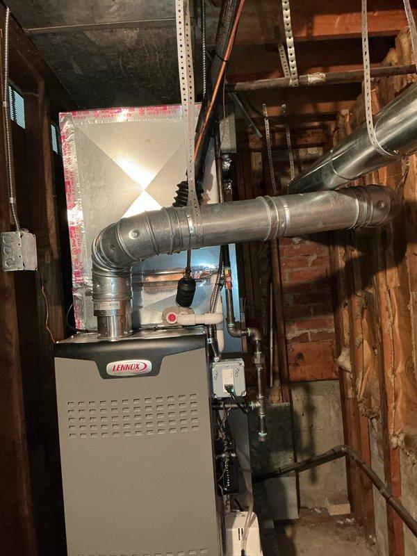 Completed comprehensive Gold AC Inspection and tune-up on a 1.5-year-old Lennox heating and cooling system located in the lower level utility room. Performed full system diagnostics, cleaned condenser coils, checked refrigerant levels and pressures, inspected electrical connections, tested thermostat operation, verified proper airflow through ductwork, and replaced air filter. System operating within manufacturer specifications with no issues identified; all components functioning properly and ready for continued service under maintenance plan.