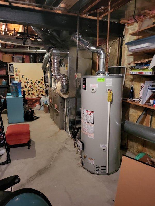 Conducted comprehensive replacement estimate for two-furnace residential system with 17-year-old equipment located in basement. Primary furnace serving main house identified with failed heat exchanger requiring immediate replacement. Secondary furnace evaluated as safe to operate but recommended for replacement due to age and matching install date of 2009. Assessed second-floor air conditioning unit operating marginally within specifications and provided replacement estimate as requested. Documented existing HVAC infrastructure including air handler location, ductwork configuration, electrical service panels, and utility room layout to prepare accurate equipment specifications and installation requirements for complete system replacement proposal.
