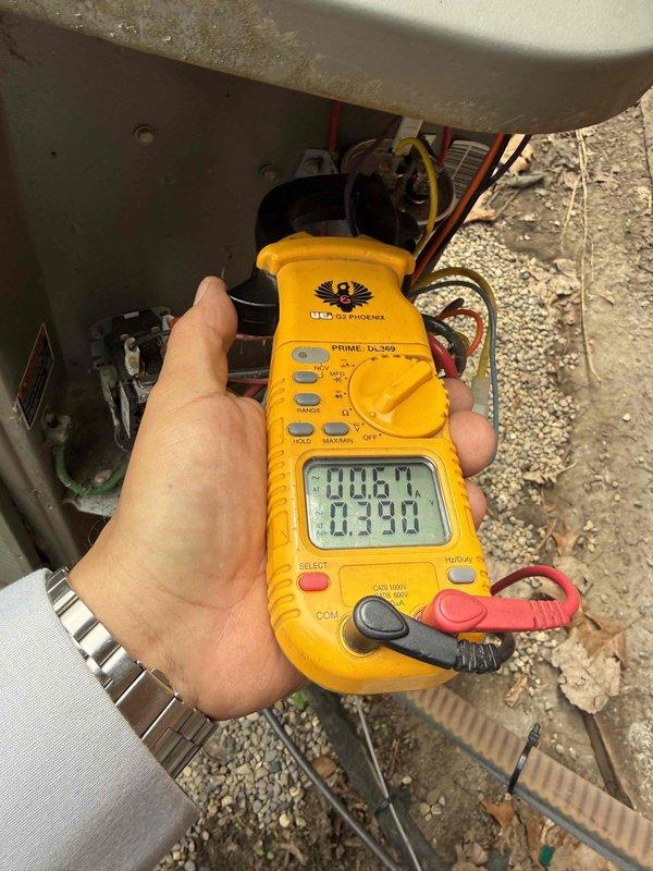 Responded to no-cooling call on 10+ year old air conditioning system. Upon arrival, performed electrical diagnostics using digital multimeter and clamp meter to test voltage and amperage at outdoor condensing unit. Inspected indoor evaporator coil in basement and verified electrical connections, control wiring, and refrigerant lines. Measured system voltages and current draw to identify cause of unit failure to start.
