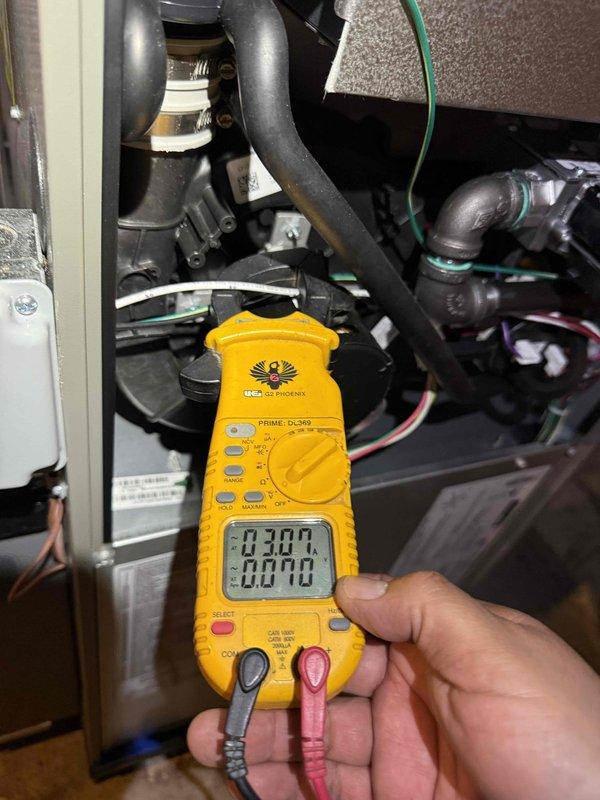 Responded to no-cooling call on 10+ year old air conditioning system. Upon arrival, performed electrical diagnostics using digital multimeter and clamp meter to test voltage and amperage at outdoor condensing unit. Inspected indoor evaporator coil in basement and verified electrical connections, control wiring, and refrigerant lines. Measured system voltages and current draw to identify cause of unit failure to start.