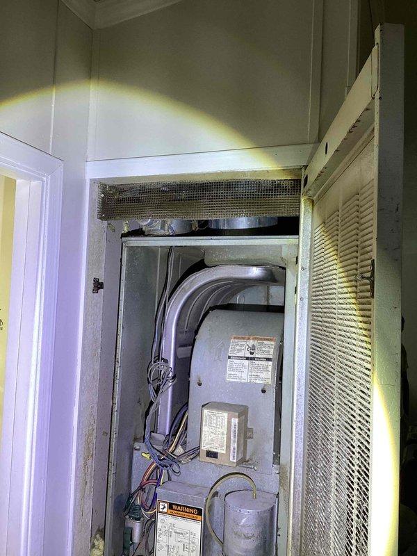 Completed diagnostic evaluation and provided replacement estimate for aging R22 air conditioning system experiencing inadequate airflow and insufficient cooling capacity. Assessed existing unit located in interior utility closet near bathroom, documented electrical panel configuration and current HVAC installation within louvered cabinet enclosure. Recommended full system replacement due to obsolete refrigerant type and equipment age affecting performance.